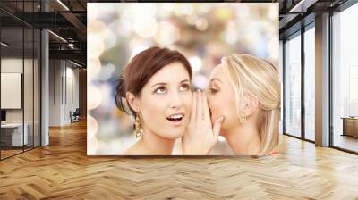 two smiling women whispering gossip Wall mural