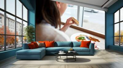 woman eating gazpacho soup at restaurant Wall mural