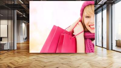 woman in pink hat and scarf with shopping bags Wall mural