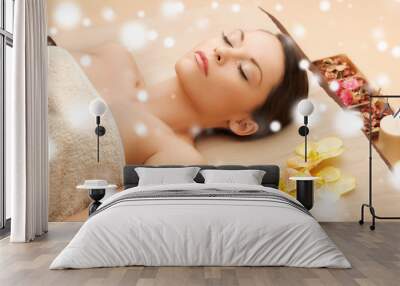 woman in spa salon lying on the massage desk Wall mural