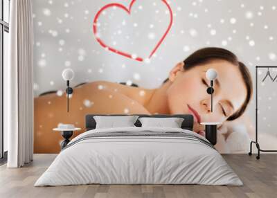 woman in spa salon with hot stones Wall mural