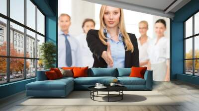 woman with an open hand ready for handshake Wall mural