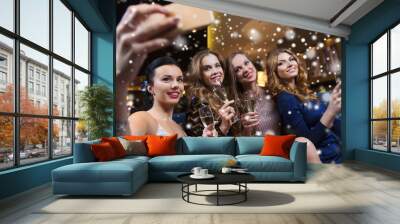 women with champagne taking selfie at night club Wall mural