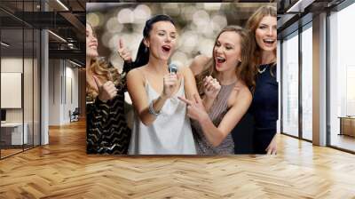 women with microphone singing karaoke at christmas Wall mural