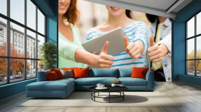 women with tablet pc showing thumbs up Wall mural