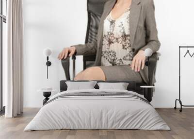 young businesswoman sitting in chair Wall mural