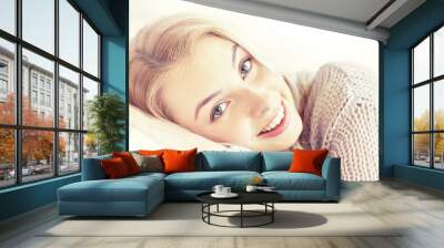 young woman or teen girl lying on pillow at home Wall mural