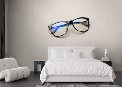 black frame blue light blocking technology anti glare spectacles glasses on grey background Wall mural