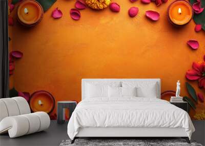 Diwali festive background with burning diya lamps and flowers over orange textured background with copy space for your greetings. Flat lay, top view. Copy space. Mock up. Banner Wall mural