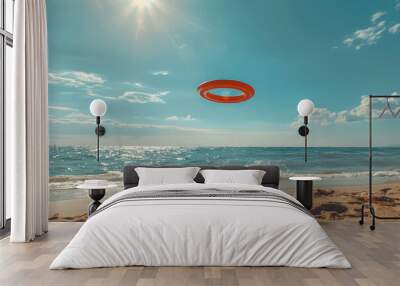 Orange plastic frisbee disc on a background of sea, beach and sky Wall mural