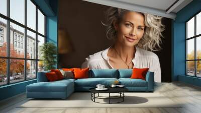 Portrait of a beautiful happy woman with gray hair, a beautiful smile, healthy facial skin in a white shirt on a gray background. Concept of facial skin care, plastic surgery, healthy eating. Wall mural