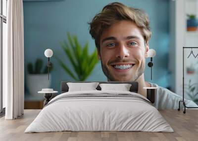 Portrait of a man with a beautiful smile and braces. Concept of straightening teeth and beautiful smile Wall mural