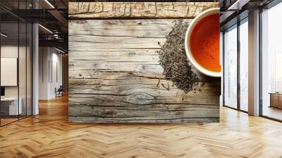 There is a white hot cup of tea on a wooden background, tea leaves, copy space. Banner Wall mural