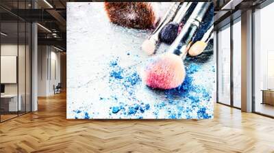 Makeup brushes and crushed eyeshadow Wall mural