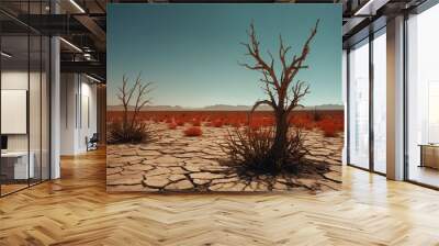 A barren desert landscape with two dead trees and a large rock Wall mural