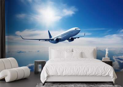 Airplane flying towards the sun in blue sky.  Aerial view of charter passenger jet, Travel and Tourism Concept Wall mural