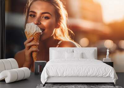 Young beautiful girl enjoying vanilla ice cream cone on a sunny day of summer holidays Wall mural