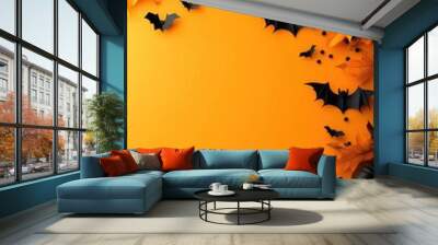 A Halloween themed background with bats and leaves Wall mural