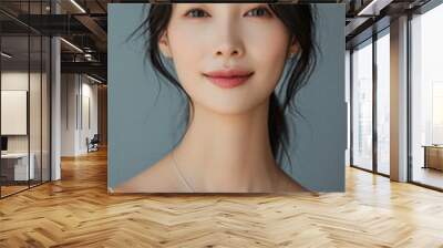 Beautiful confident young adult Asian woman posing for beauty portrait. Pretty smiling happy healthy girl student model from Asia looking at camera smiling on background. Close up face . Wall mural