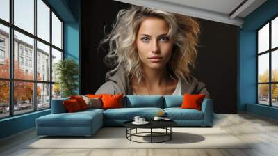 Portrait of beautiful young woman with flying hair on dark background. Wall mural