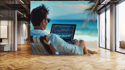 Successful rich stock trading investor, man trader or broker relaxing on summer beach at sea using laptop computer investing money in rising financial market analyzing charts on screen. Over shoulder. Wall mural