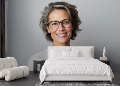 Young woman with glasses and arms crossed Wall mural