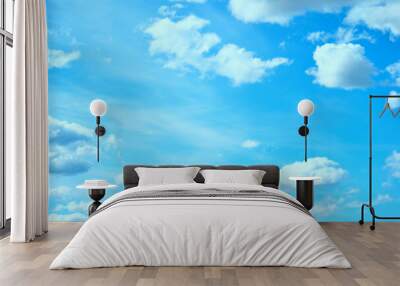 Blue sky background with white clouds lit by sunlight, colorful blue cloudy sky background Wall mural