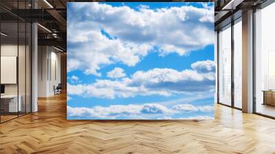 Blue sky background with white colorful sky clouds floating in the blue sky. Cloudy sky landscape scene. Blue sky with clouds Wall mural