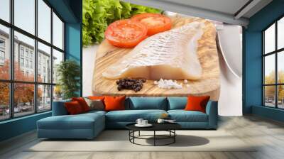 haddock fillet on a wooden board Wall mural