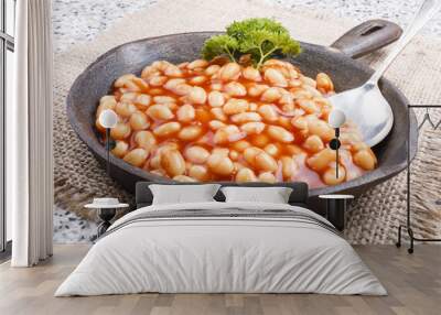 warm baked beans in tomato sauce served in a cast iron pan Wall mural