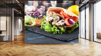 Doner kebab - fried minced meat  in pita bread Wall mural