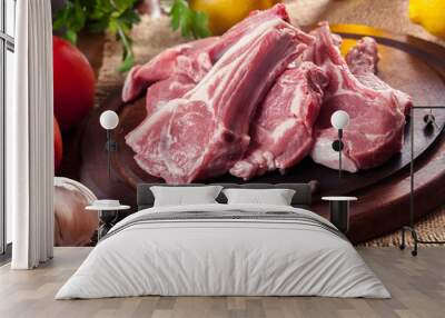 Raw fresh lamb chops on wooden cutting board Wall mural