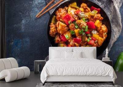 Sweet and sour chicken with colorful bell pepper on a plate Wall mural