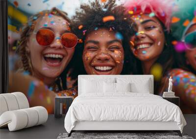 Fashionable modern people dancing and rejoicing. Joyful friends celebrating carnival with colorful confetti and festive accessories Wall mural