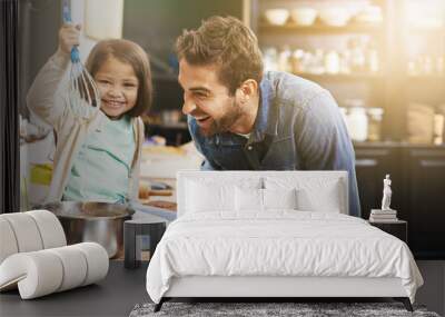 This is how you make the perfect pancake batter. Shot of a father and daughter making pancakes together. Wall mural