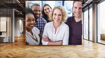 We work for success rather than just dream about it. Portrait of a team of designers standing together in the office. Wall mural