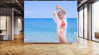 Beautiful Girl at warm country. Travel and Vacation. Freedom Concept. Sensual red hair beautiful woman, lady with perfect fashionable body figure ,Marine style  Wall mural