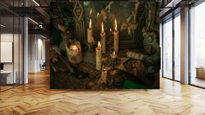 Candle burns on the altar, powerful magic among candles, pagan or wicca concept Wall mural