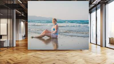 Plus size woman in holidays, Picturesque view of the beach. Vacations and adventure concept   Wall mural