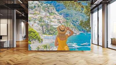 Vacation in Italy. Woman tourist enjoying vacation sun and views. Inspiration Positano, Amalfi coast Wall mural