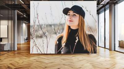 Woman wear black turtleneck, jeans and baseball cap, girl in sand desert. Fashionable casual style, fashion and clothes concept of modern look  Wall mural