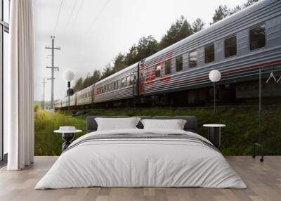 Red-gray passenger long-distance train close-up. Russian Railways. Wall mural