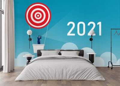 businessman looking in telescope seeing 2021 of year future on the balloon. design vector illustrator Wall mural