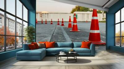 Orange traffic cone in white background Wall mural