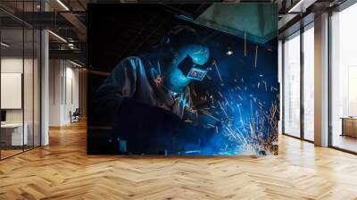 worker with protective mask welding metal Wall mural