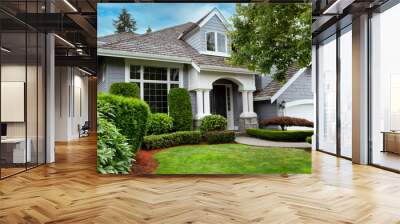 Close up view of a modern home with cedar shake roof during summer Wall mural