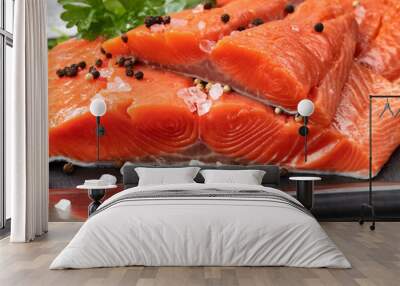 Fresh raw pacific wild king salmon fillets on natural stone with spices and basil leaves Wall mural