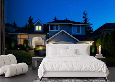 Sky with stars in background of suburban home during late evening Wall mural