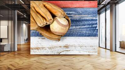 worn baseball mitt and ball on faded boards painted in USA colors Wall mural