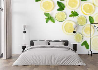 Styled stock photo. Summer herbs and fruit composition. Lime, lemon slices and fresh green mint leaves isolated on white table background. Juicy food pattern. Decorative corner. Flat lay, top view. Wall mural